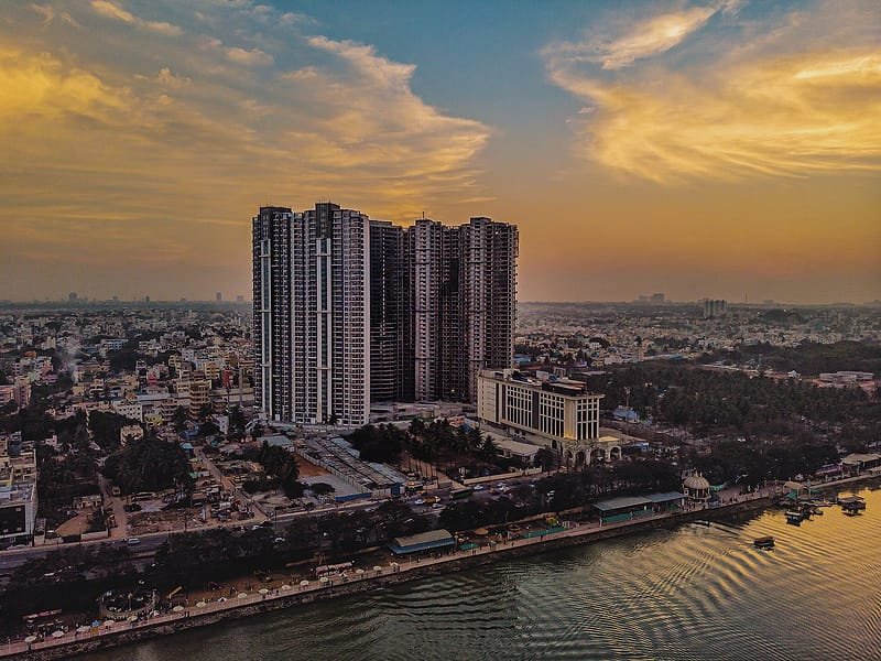Apartment towers beside Nagawara Lake, Bengaluru, at golden hour